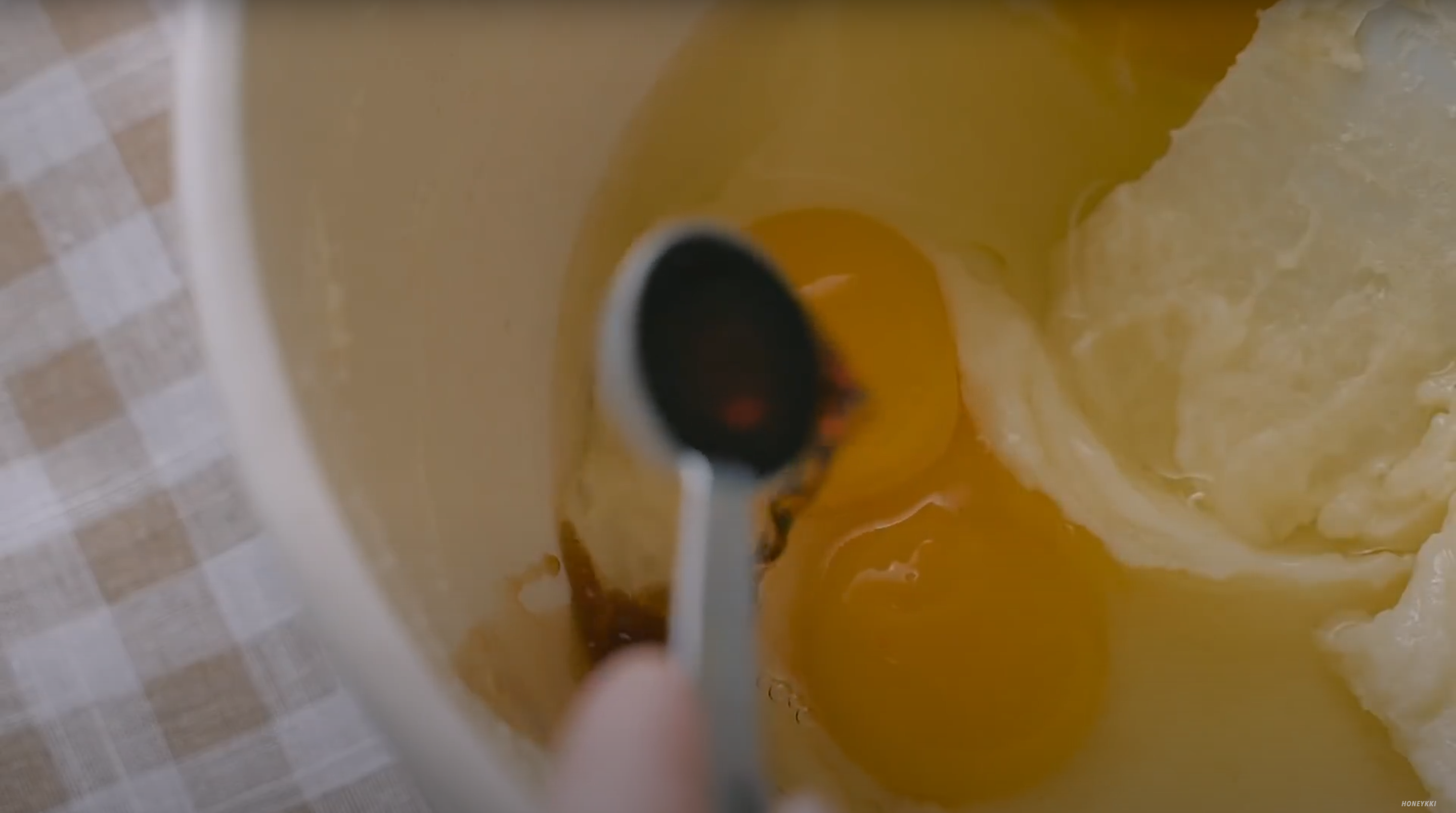 image of adding vanilla extract to eggs in butter mixture